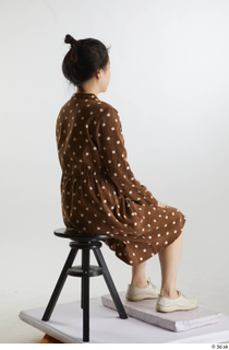 Aera  1 brown dots dress casual dressed sitting white…